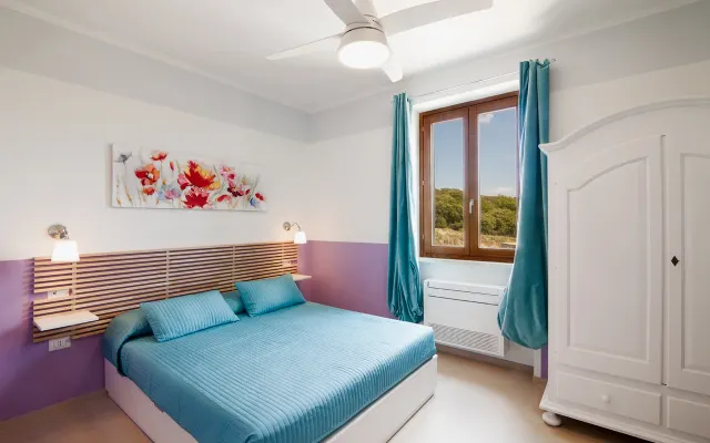 Chambre supérieure avec vue sur le parc de la Maremme