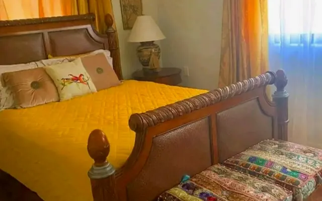 The Gold Room, bedroom with private bathroom, common areas are shared.