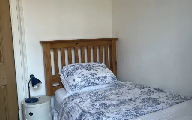 Cost private room in second floor flat.