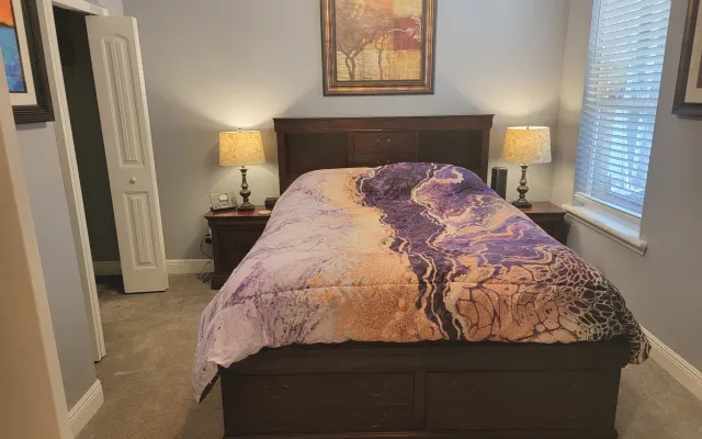 Beautiful bedroom for rent with use of clothing optional pool.