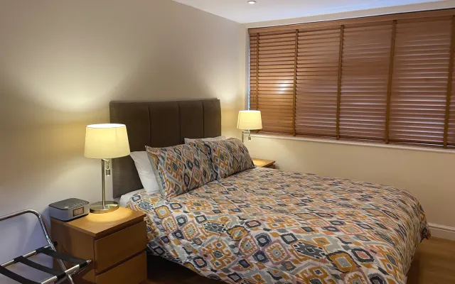 Detached large ensuite guest suite including kitchenette and parking.
