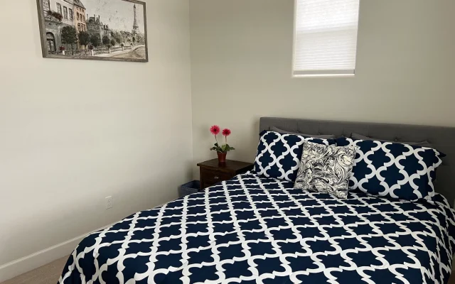 A cozy private room and private bathroom in a clothing optional home!