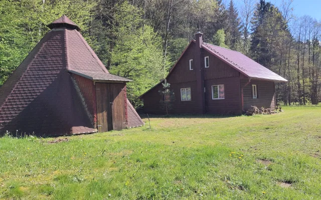 Room in off-grid cottage in mountain forest