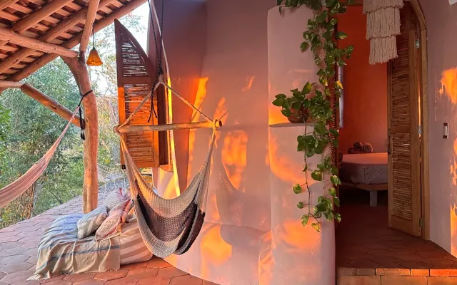 Built with organic materials and shapes and integrated with nature