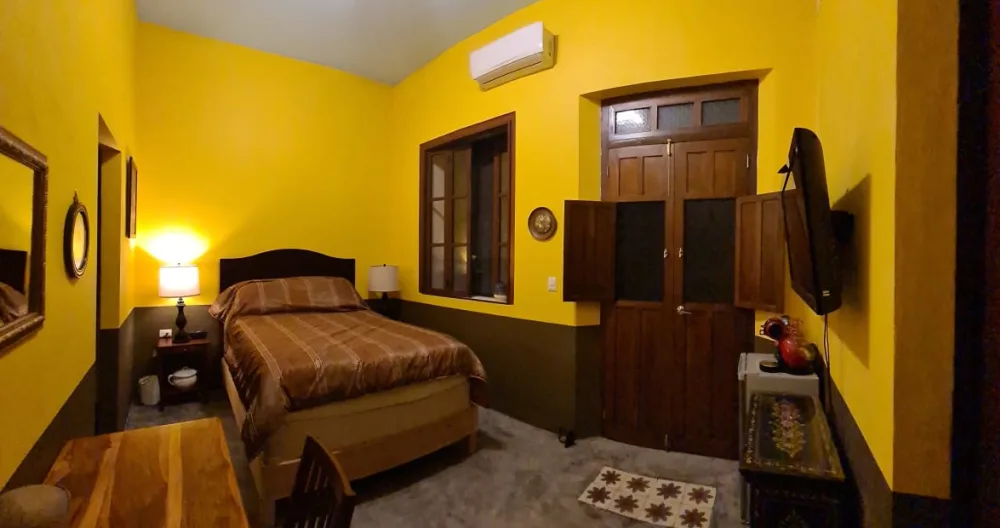 Rafael's listing on misterb&b - spacious bedroom with high ceiling, makes ir be fresh, has ceiling fan and A/C,  big window for light but private