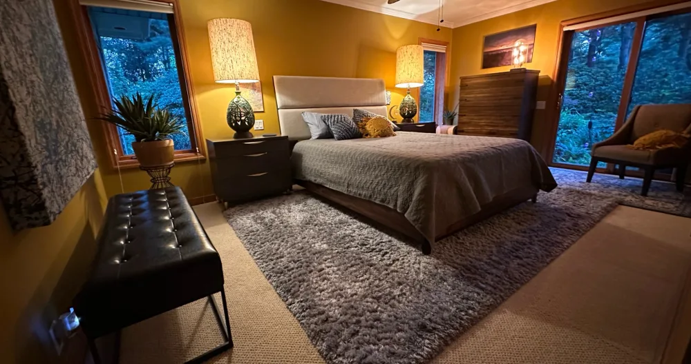 David's listing on misterb&b - Your bedroom includes many of Dave’s favorite MCM pieces that he’s had in his family, some for over 50 yrs. This room has a sliding patio door spilling into a little oasis of gardens. A small sitting area for coffee or alone time. 
