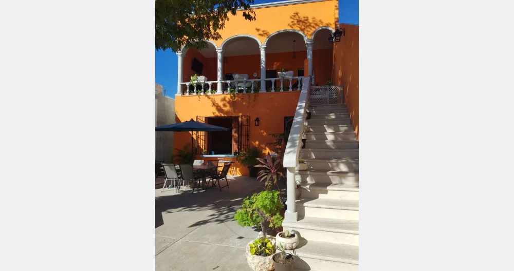 Rafael's listing on misterb&b - outside stairs to the bedroom, large balcony with kitchenette, table and chairs to have a nice breakfast and also a stationary bike and elliptical to do part of your workouts 