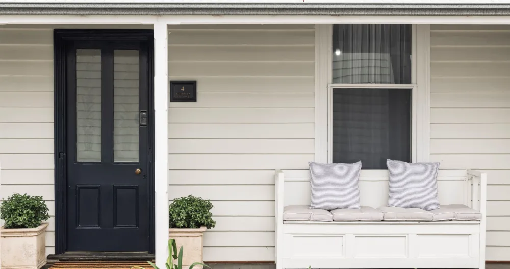 Belinda's listing on misterb&b - Gorgeous Fishermans Cottage built c1860.  Front Facade is white with Navy Blue door.  Peaceful spot to sit on the covered verandah 