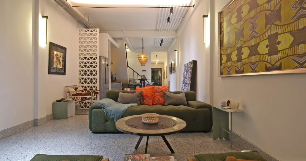 Mihael's listing on misterb&b - 【Living Room】120" projector with Alexa sound system and HDMI. Lounge seating for 3. Board games and books ******** atmosphere envisioned by the home designer Oman whose photographies adorn the walls. Enjoy moments together with your closest!