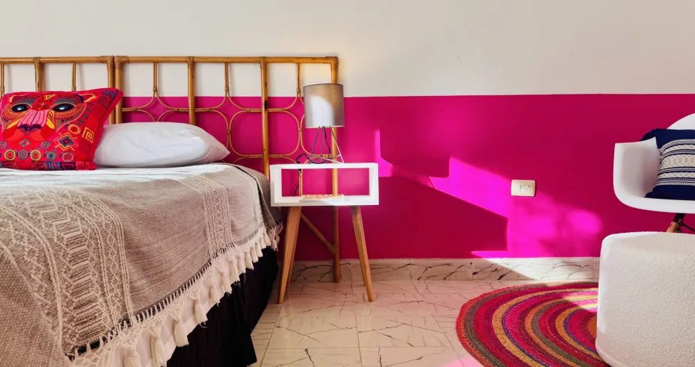 Richie's listing on misterb&b - La Habitación Rosa features a full-sized bed with linen sheets and handmade Oaxaca blankets. 