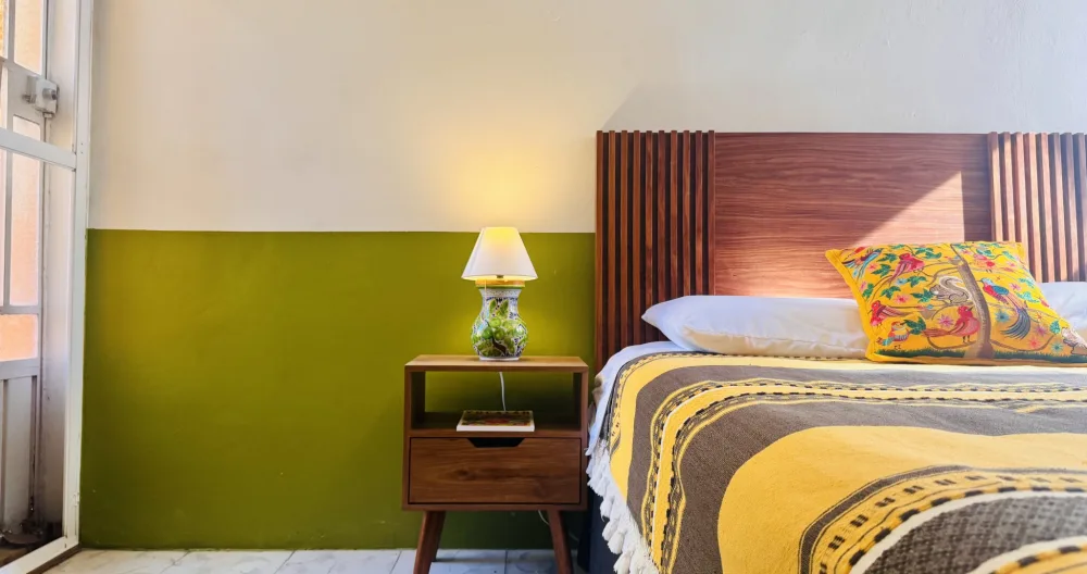 Richie's listing on misterb&b - La Habitación Verde features a full-sized bed with linen sheets and handmade Oaxaca blankets. 