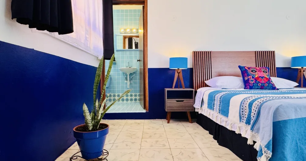 Richie's listing on misterb&b - La Habitación Azul features a full-sized bed with linen sheets and handmade Oaxaca blankets